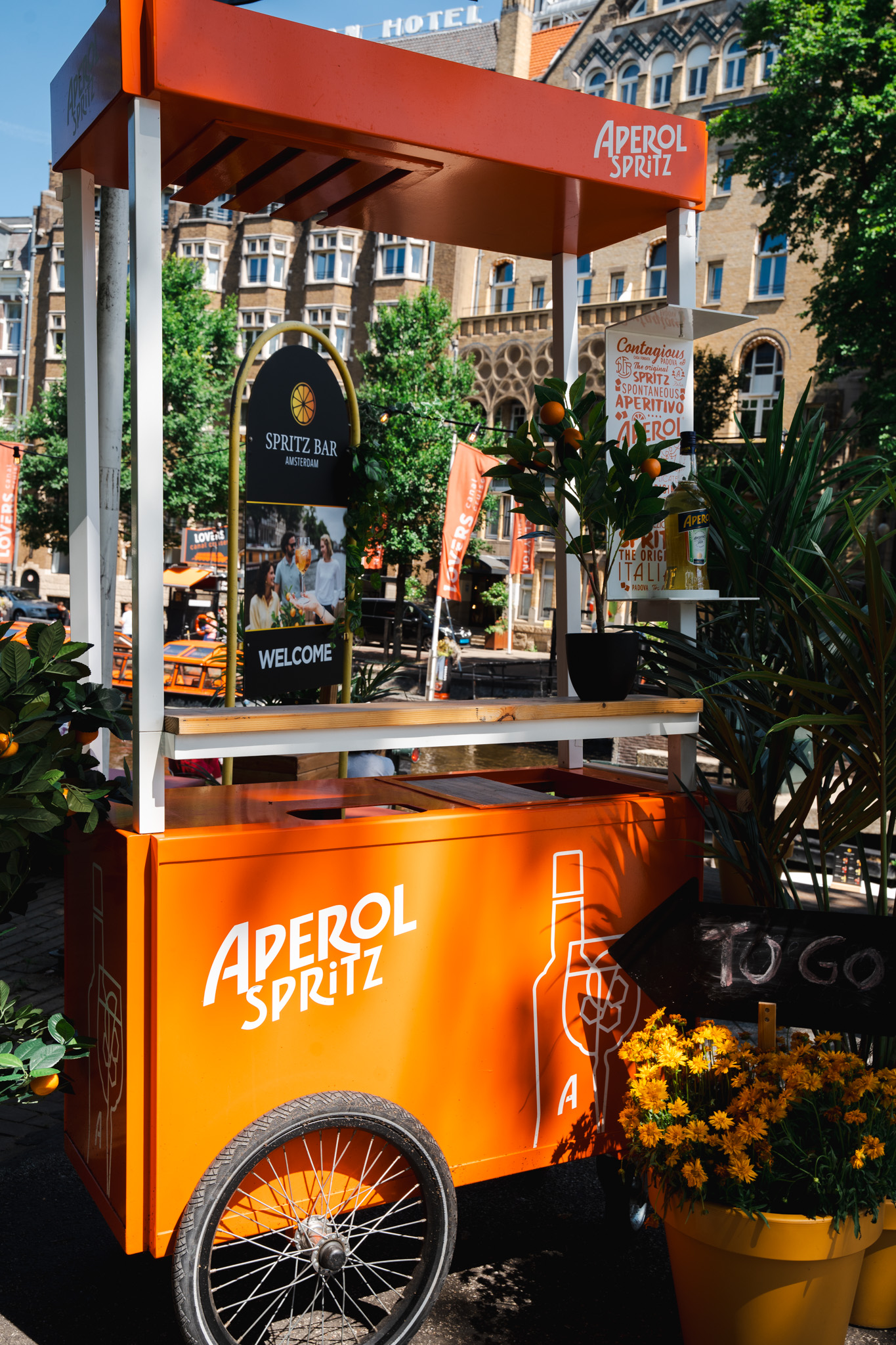 Aperol Spritz branded orange cart outside Spritz Bar Amsterdam