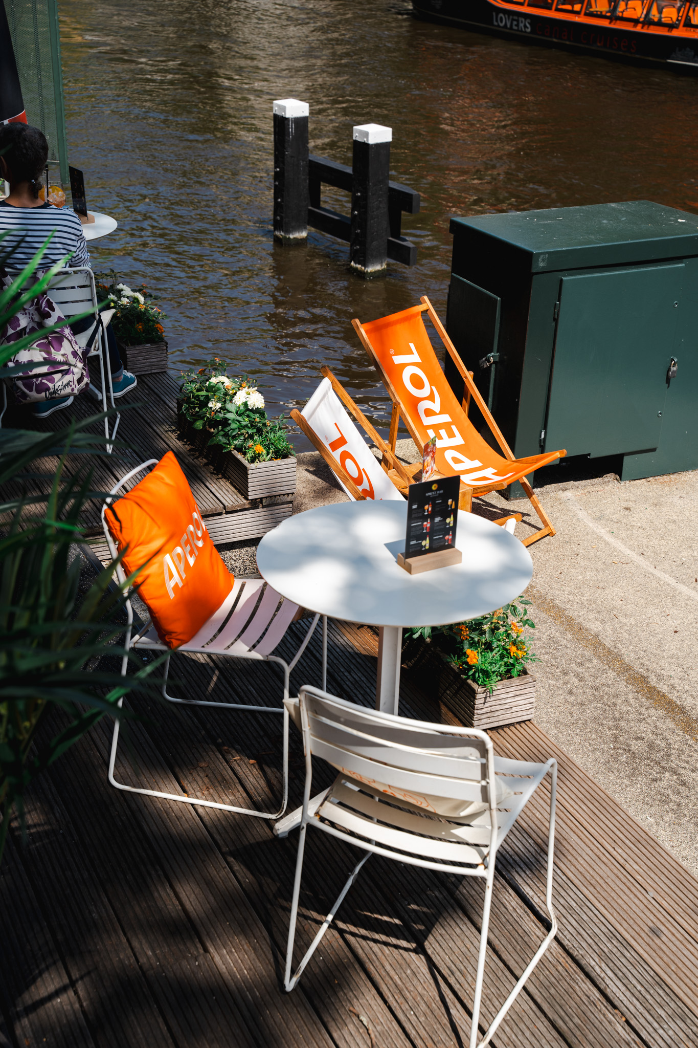 Aerial view of Spritz Bar Amsterdam terrace with deck chairs and canal